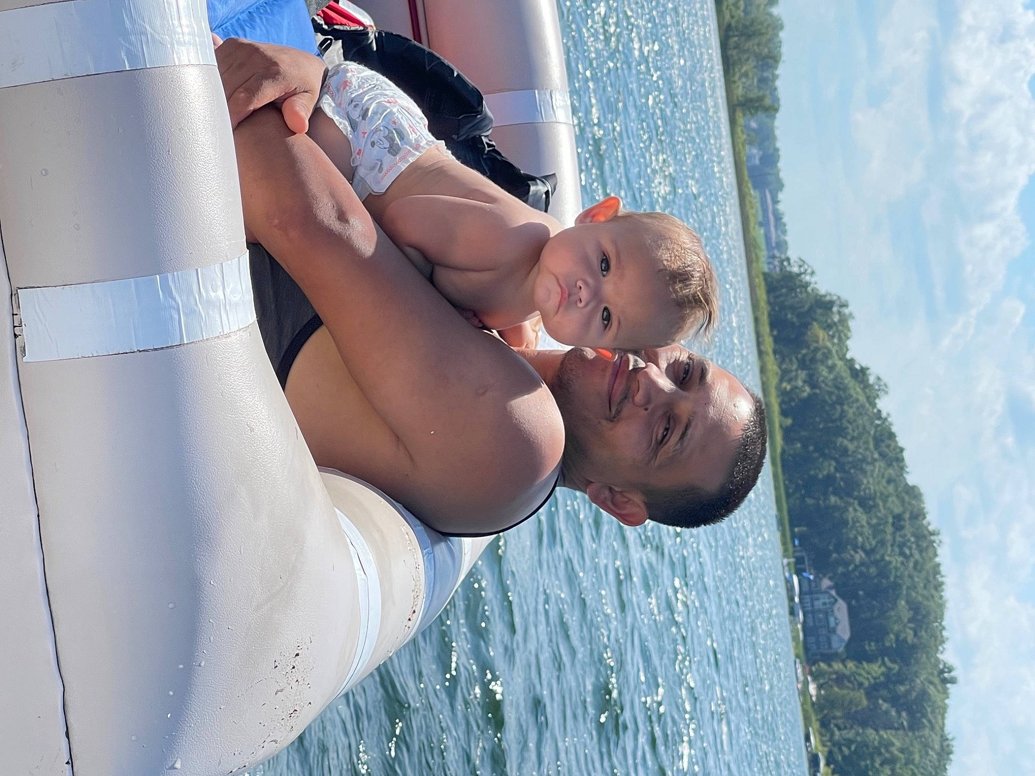 Jesus is registered to the contest to win money with this photo: arm, blue, child, elbow, fun, gesture, happy, joy, lake, leisure, people_in_nature, person, plant, recreation, shorts, sky, smile, t_shirt, thigh, tree