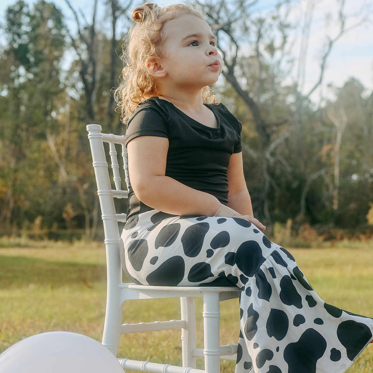 Laurie joined the competition — help win amazing prizes! balloon, beachwear, child, clothing, dress, eveningdress, face, female, formalwear, furniture, girl, happy, head, pants, person, photography, portrait, sitting, sleeve, smile