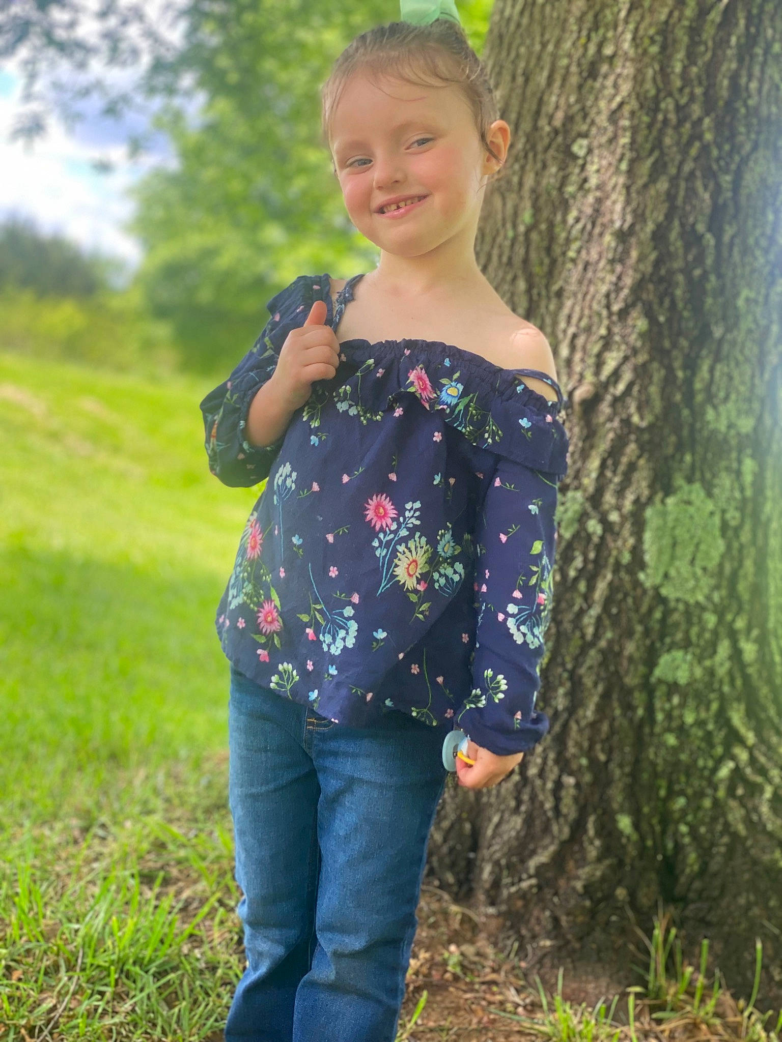 Rosalie joined the competition — help win amazing prizes! clothing, denim, gesture, grass, green, hair, happy, human_body, jeans, joy, long_hair, people_in_nature, person, plant, shoulder, sleeve, smile, t_shirt, tree, trunk