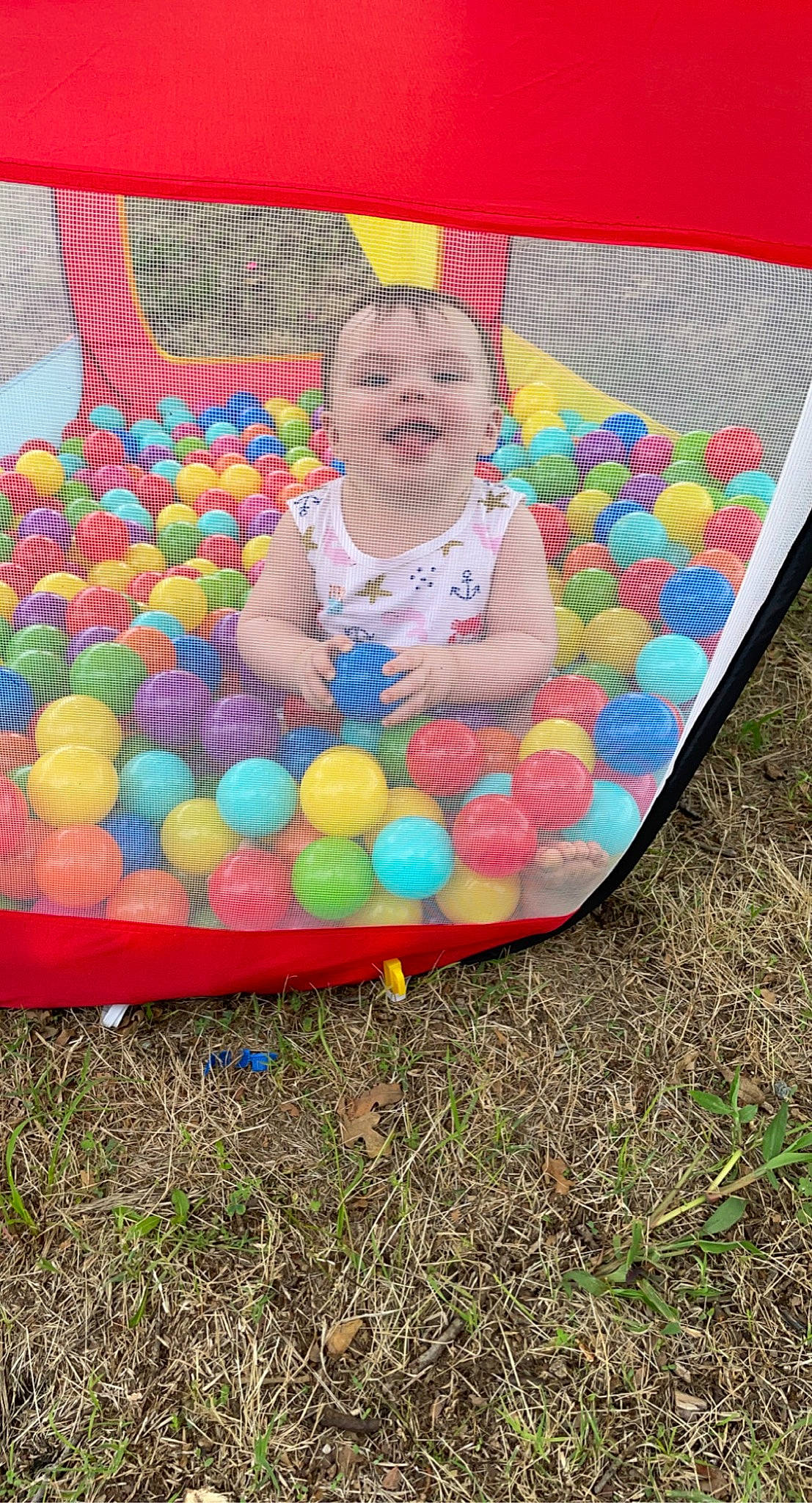 Paisley is registered to the contest to win money with this photo: baby, baby_products, baby_toddler_clothing, ball, ball_pit, child, circle, comfort, event, fun, grass, happy, leisure, pattern, person, play, recreation, sitting, smile, t_shirt