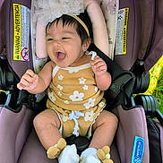 Mary joined the competition — help win amazing prizes! baby, infant, car_seat, purple, headband, flower, romper, smiling, happy, sitting, outdoors, child, cute, clothing, footwear, sock, seatbelt, toy, protectplus, snugride_lite