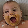 baby, bib, cheeks, closeup, clothing, cute, expression, eyes, face, feeding, food, happy, head, indoor, infant, messy, mouth_open, skin, smile, tongue