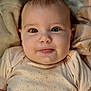Lylou participe au concours pour gagner de l'argent avec cette photo : baby, infant, face, eyes, tongue, onesie, clothing, blanket, soft, cute, portrait, child, young, expression, skin, head, cheeks, cozy, warm, indoors
