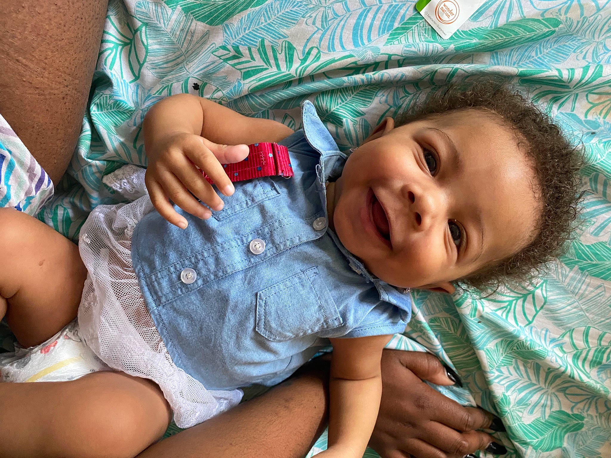 Annalayah is registered to the contest to win money with this photo: baby_toddler_clothing, comfort, eye, face, facial_expression, grass, hairstyle, happy, human, human_body, leaf, leg, mammal, mouth, nose, organ, person, skin, smile, textile