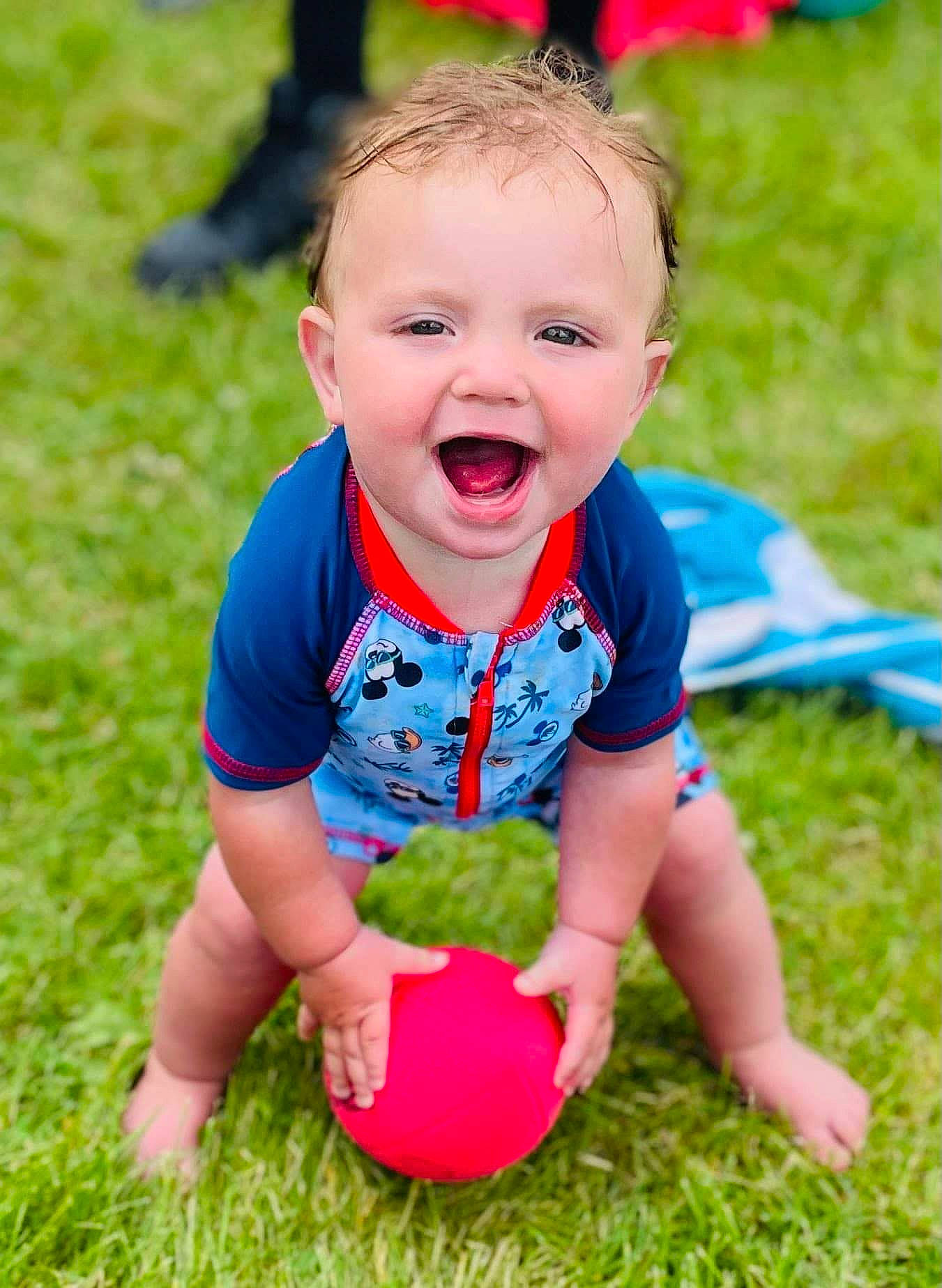 Barrett is registered to the contest to win money with this photo: baby, baby_playing_with_toys, baby_toddler_clothing, ball, child, fun, grass, happy, head, laugh, lawn, leisure, people_in_nature, person, play, playing_sports, recreation, shorts, sitting, smile