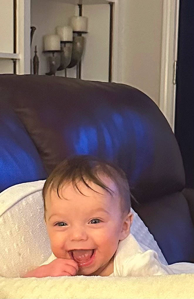 Helen is registered to the contest to win money with this photo: architecture, baby, babylaughing, bodypart, building, candle, couch, cushion, face, furniture, happy, head, homedecor, laughing, mouth, person, photography, portrait, smile, teeth