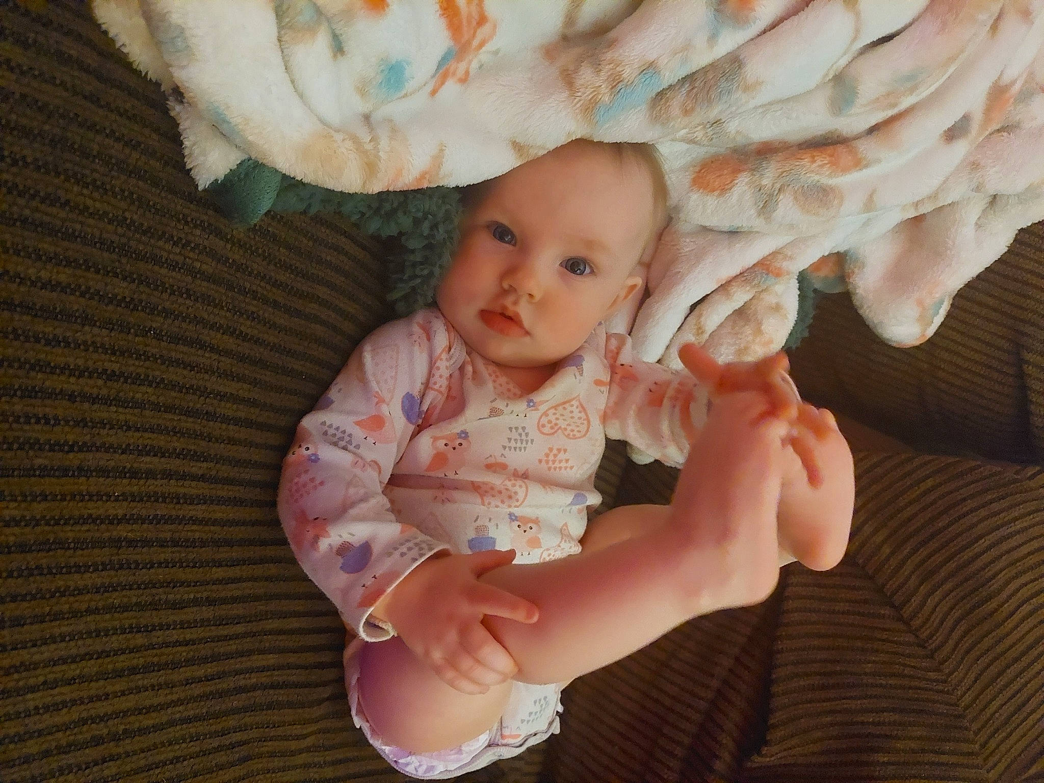 Emberly is registered to the contest to win money with this photo: arm, baby, baby_toddler_clothing, cheek, comfort, dress, eye, finger, gesture, hand, happy, human_body, iris, lip, nose, person, skin, sleeve, textile, thumb