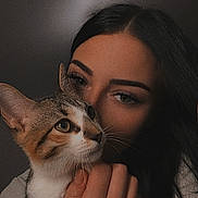 Athena participe au concours pour gagner de l'argent avec cette photo : cat, person, face, hand, tattoo, tabby_cat, close_up, portrait, indoor, pet, animal, love, affection, brown_eyes, dark_hair, whiskers, fur, holding, looking_away, warm_lighting
