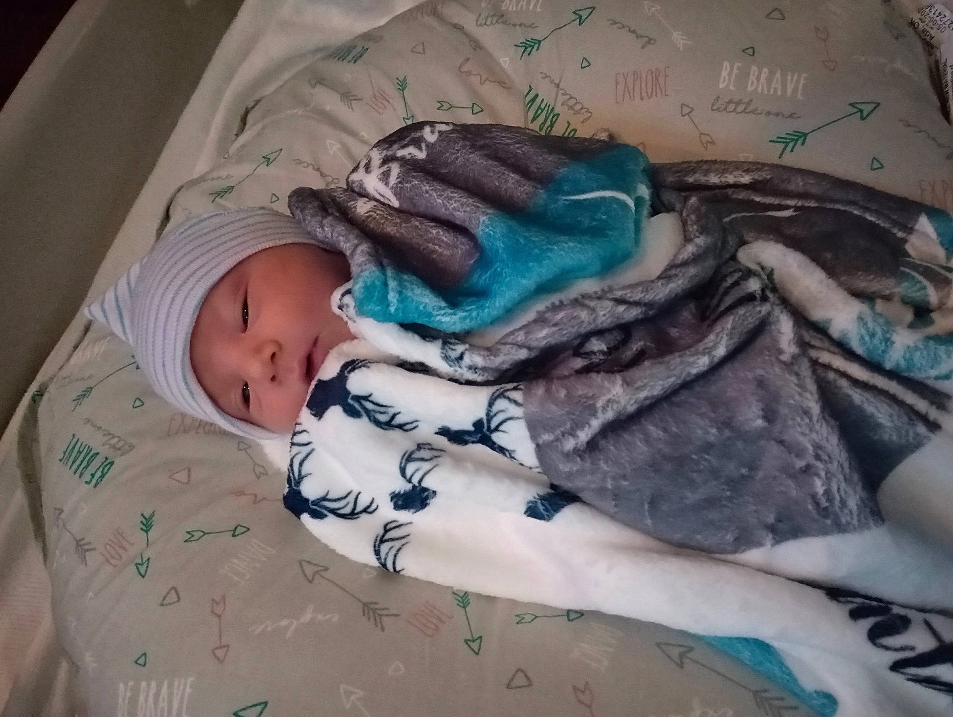 Lochlan is registered to the contest to win money with this photo: architecture, baby, bed, blanket, bonnet, building, cap, clothing, crib, face, furniture, glove, hat, head, infantbed, newborn, person, photography, portrait, quilt