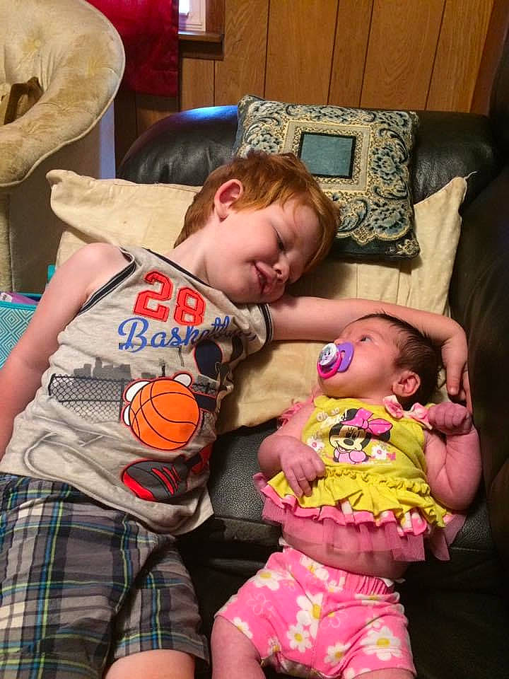 Piper joined the competition — help win amazing prizes! baby, baby_products, baby_toddler_clothing, cheek, child, couch, eye, facial_expression, fun, happy, head, pattern, people, person, pillow, plaid, room, shorts, skin, tartan