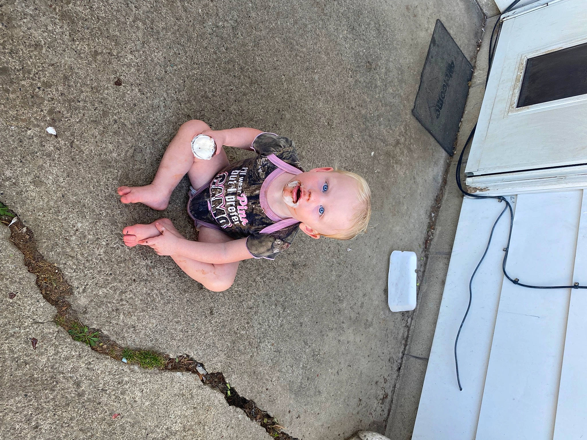 Aurora is registered to the contest to win money with this photo: asphalt, automotive_exterior, bumper, child, city, concrete, driveway, family_car, flooring, fun, human_leg, person, recreation, road, road_surface, shadow, sidewalk, street, tar, toddler