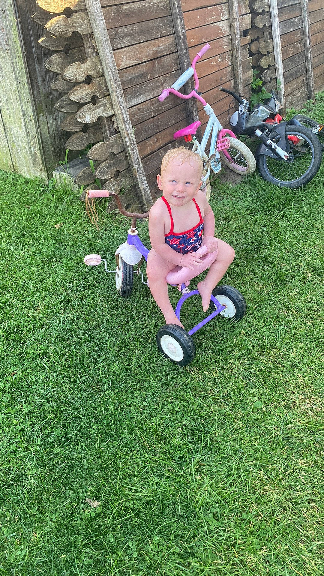Aurora is registered to the contest to win money with this photo: baby, ball, bicycle_fork, bicycle_frame, bicycle_tire, bicycle_wheel, football, fun, grass, happy, joy, lawn, leisure, people_in_nature, person, plant, recreation, shorts, tire, toddler