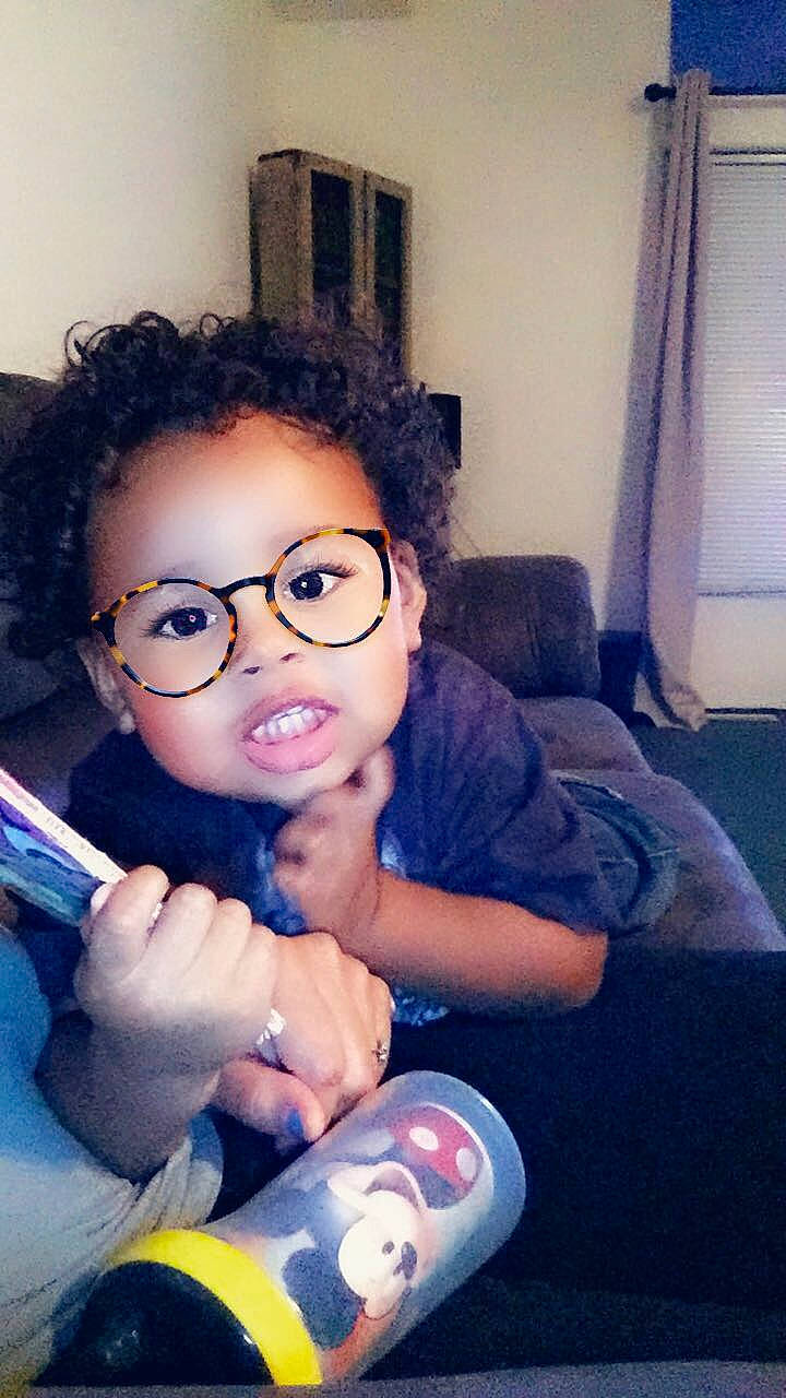 Donovan is registered to the contest to win money with this photo: black_hair, child, cool, eyewear, forehead, glasses, nose, person, selfie, smile, toddler, vision_care