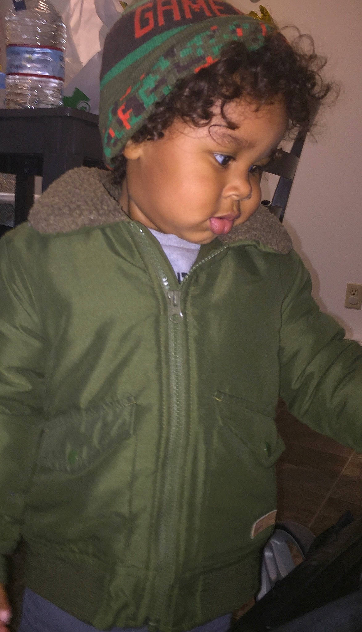 Donovan is registered to the contest to win money with this photo: child, cool, forehead, fun, headgear, jacket, outerwear, person