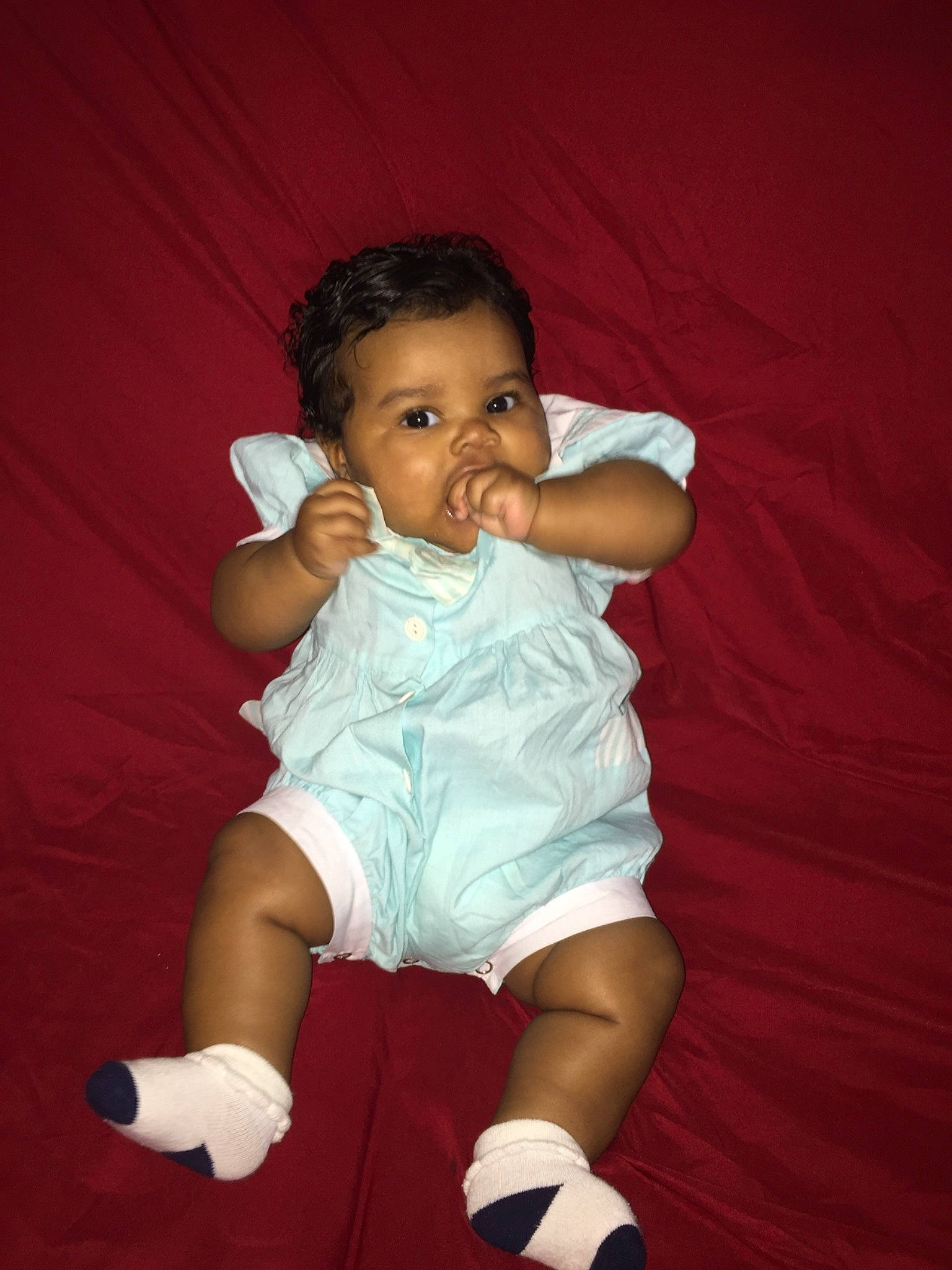 Alani is registered to the contest to win money with this photo: arm, baby, child, finger, fun, person, sitting, skin, smile, toddler