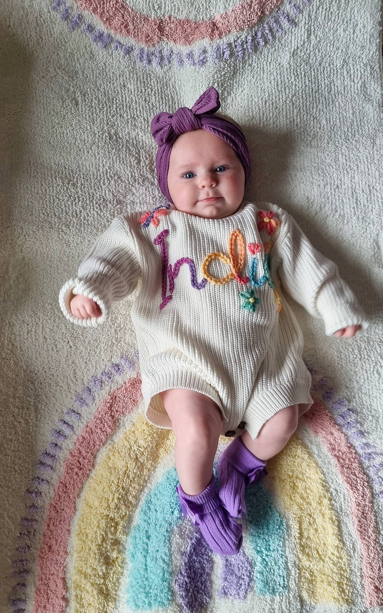 Indié joined the competition — help win amazing prizes! arm, baby_toddler_clothing, cap, doll, dress, eye, fawn, head, headgear, iris, knit_cap, magenta, pattern, person, pink, purple, skin, sleeve, textile, toy