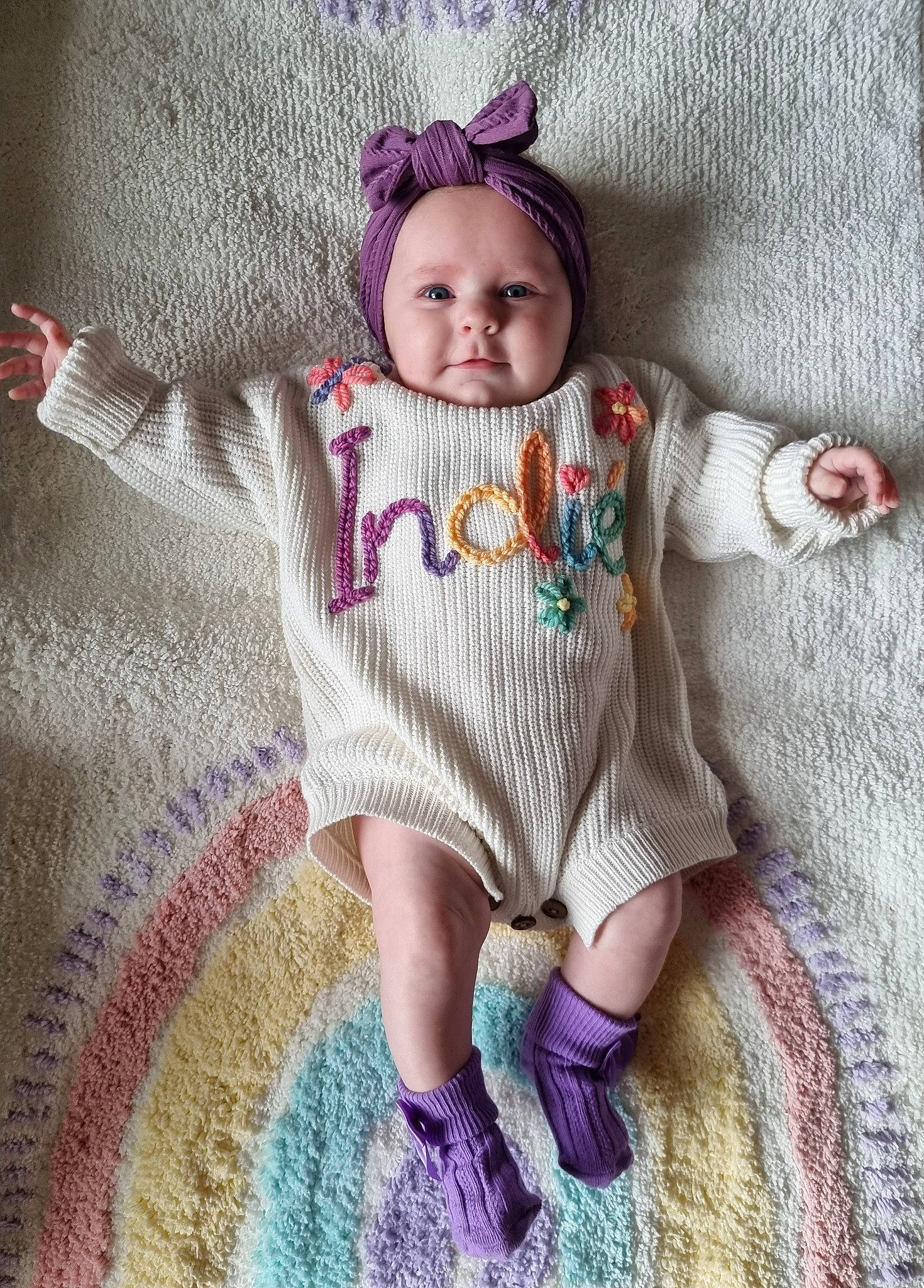 Indié joined the competition — help win amazing prizes! baby, baby_toddler_clothing, cheek, doll, dress, eye, face, grey, head, headgear, iris, magenta, outerwear, pattern, person, pink, purple, skin, sleeve, textile