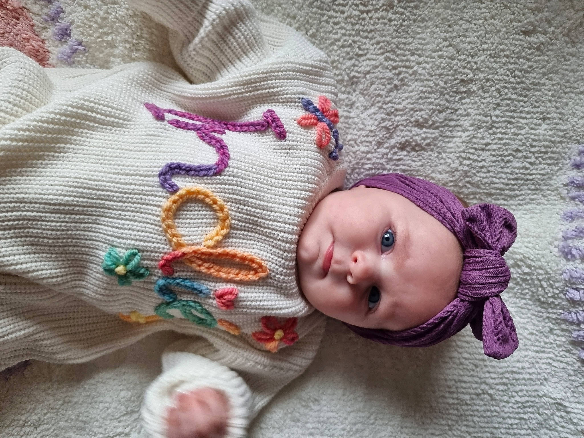 Indié joined the competition — help win amazing prizes! baby, baby_products, baby_toddler_clothing, cap, cheek, comfort, doll, fashion_accessory, knit_cap, linens, magenta, pattern, person, pink, purple, skin, sleeve, toddler, toy, wood