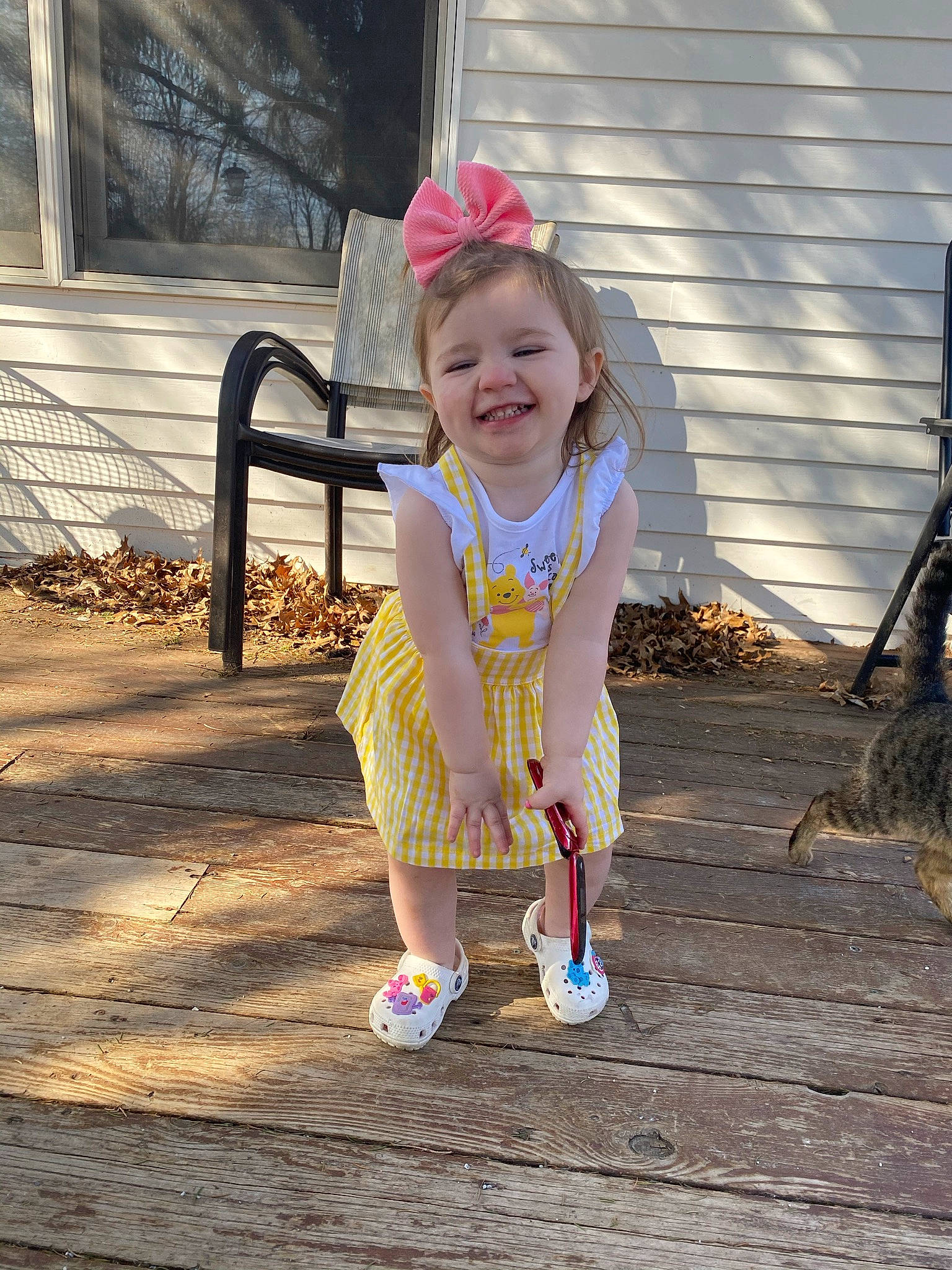 Hattie joined the competition — help win amazing prizes! baby, baby_toddler_clothing, child, city, fun, grass, happy, joy, leisure, magenta, pattern, people_in_nature, person, play, recreation, sandal, shorts, sitting, smile, toddler