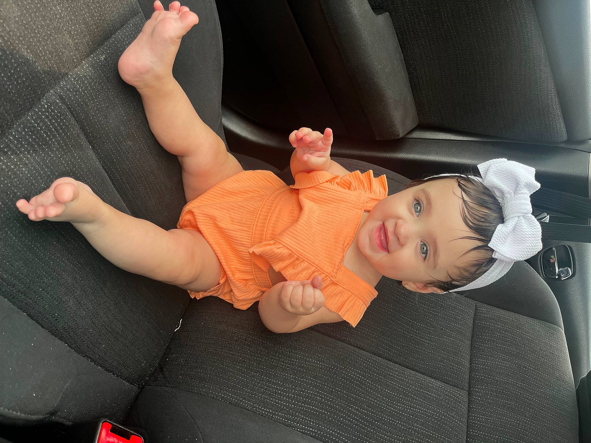 Laiyah is registered to the contest to win money with this photo: auto_part, baby, baby_products, car_seat, child, comfort, finger, hand, human_body, human_leg, joint, knee, leg, person, skin, thigh, tire, toddler, vehicle, vehicle_door
