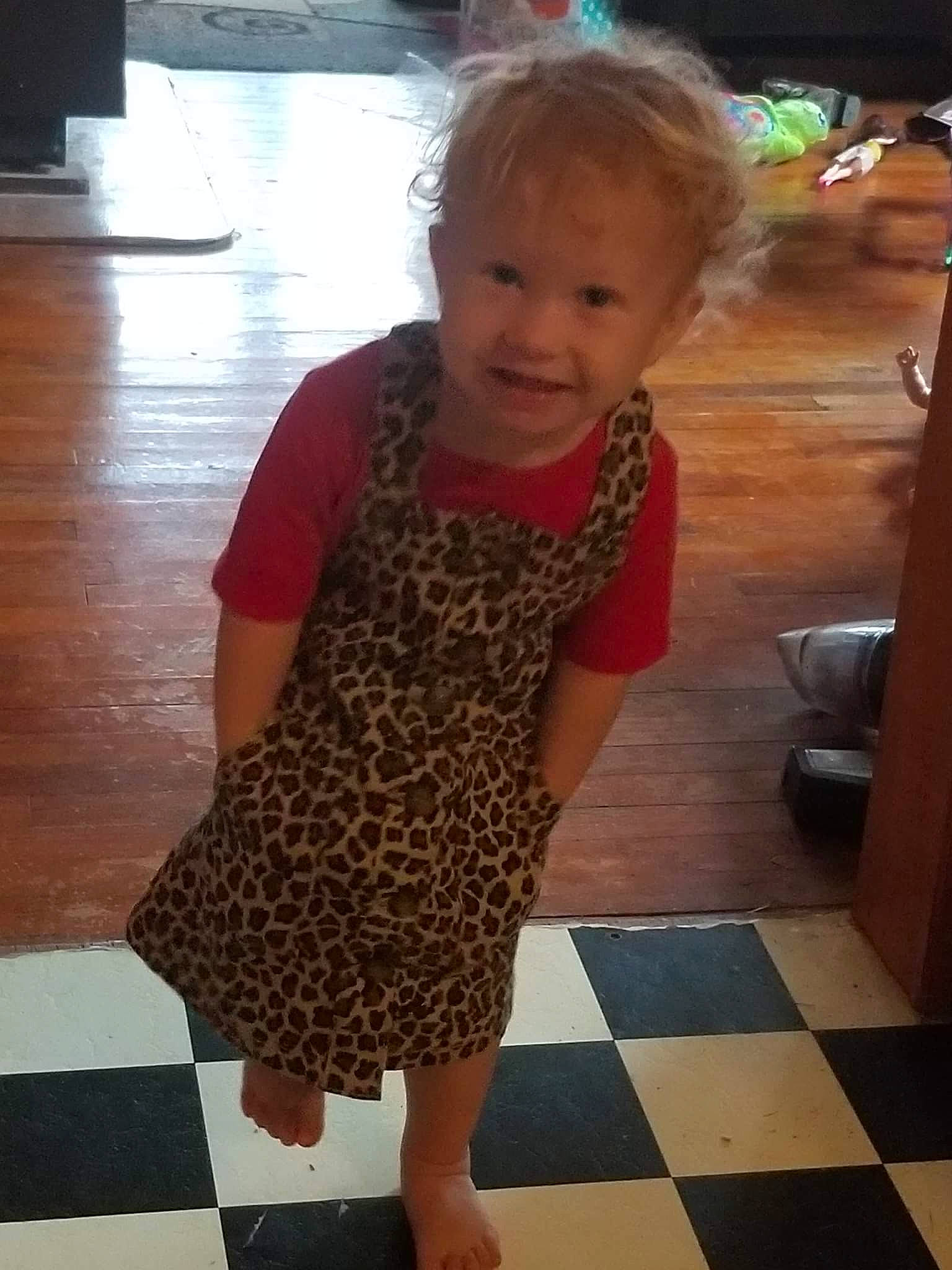 Jazlyn is registered to the contest to win money with this photo: baby, baby_toddler_clothing, beauty, child, floor, flooring, fun, hair, hairstyle, hardwood, head, joint, knee, person, skin, sleeve, smile, standing, thigh, toddler