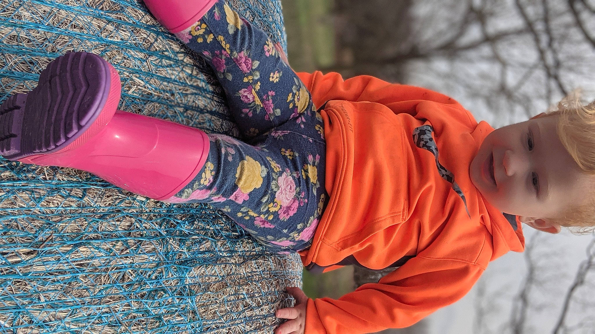 Jazlyn is registered to the contest to win money with this photo: arm, denim, electric_blue, human_leg, joint, knee, magenta, orange, outerwear, pattern, person, pink, plaid, red, sleeve, street_fashion, tartan, textile, thigh, tree