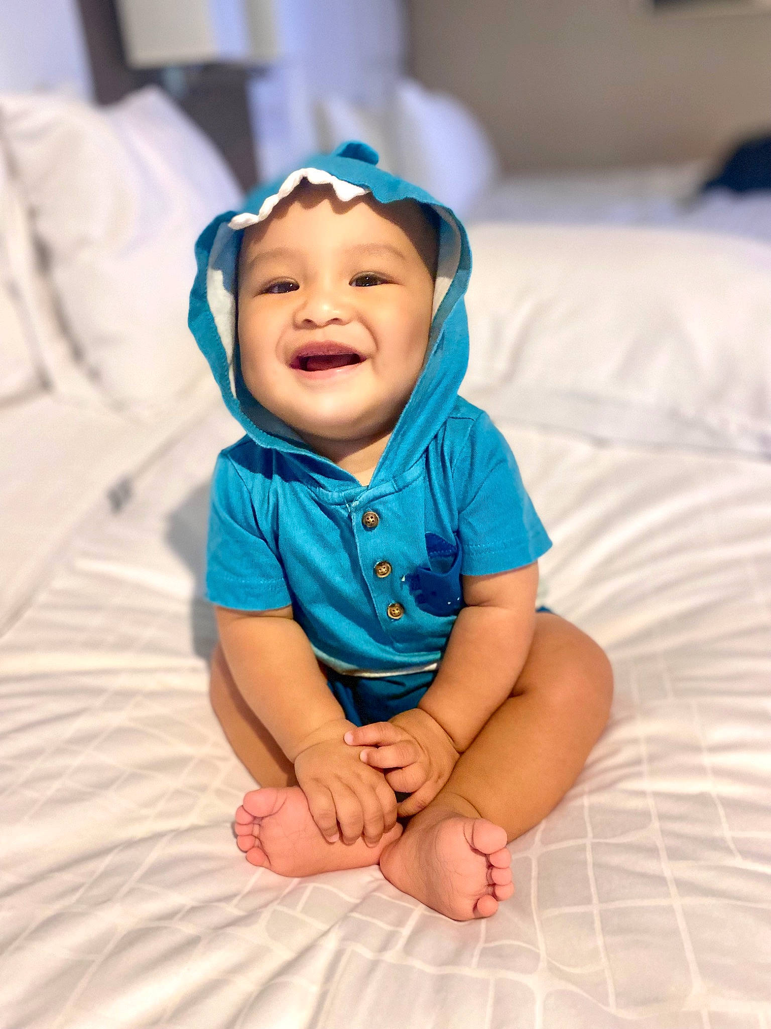Kenai is registered to the contest to win money with this photo: baby, baby_toddler_clothing, cap, chin, clothing, comfort, electric_blue, eye, face, finger, flash_photography, fun, happy, head, joy, linens, person, skin, sleeve, smile