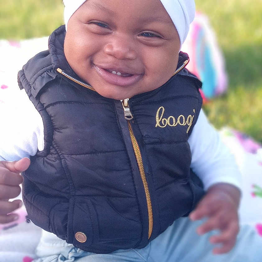 Liberty joined the competition — help win amazing prizes! baby, bonnet, cap, car, clothing, coat, face, grass, happy, hat, head, jacket, pants, person, photography, plant, portrait, smile, transportation, vehicle