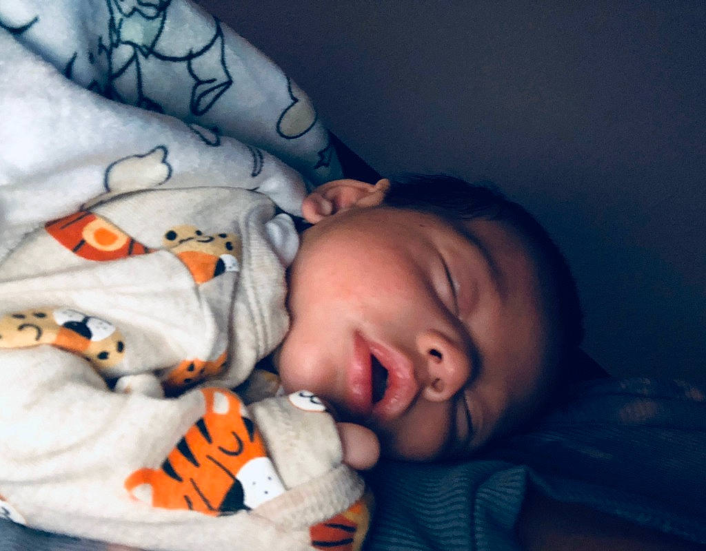 Jesus Estevan joined the competition — help win amazing prizes! baby, baby_sleeping, baby_toddler_clothing, cheek, comfort, cool, eye, eyebrow, finger, hand, head, human_body, iris, lip, mouth, nose, orange, person, skin, sleeve