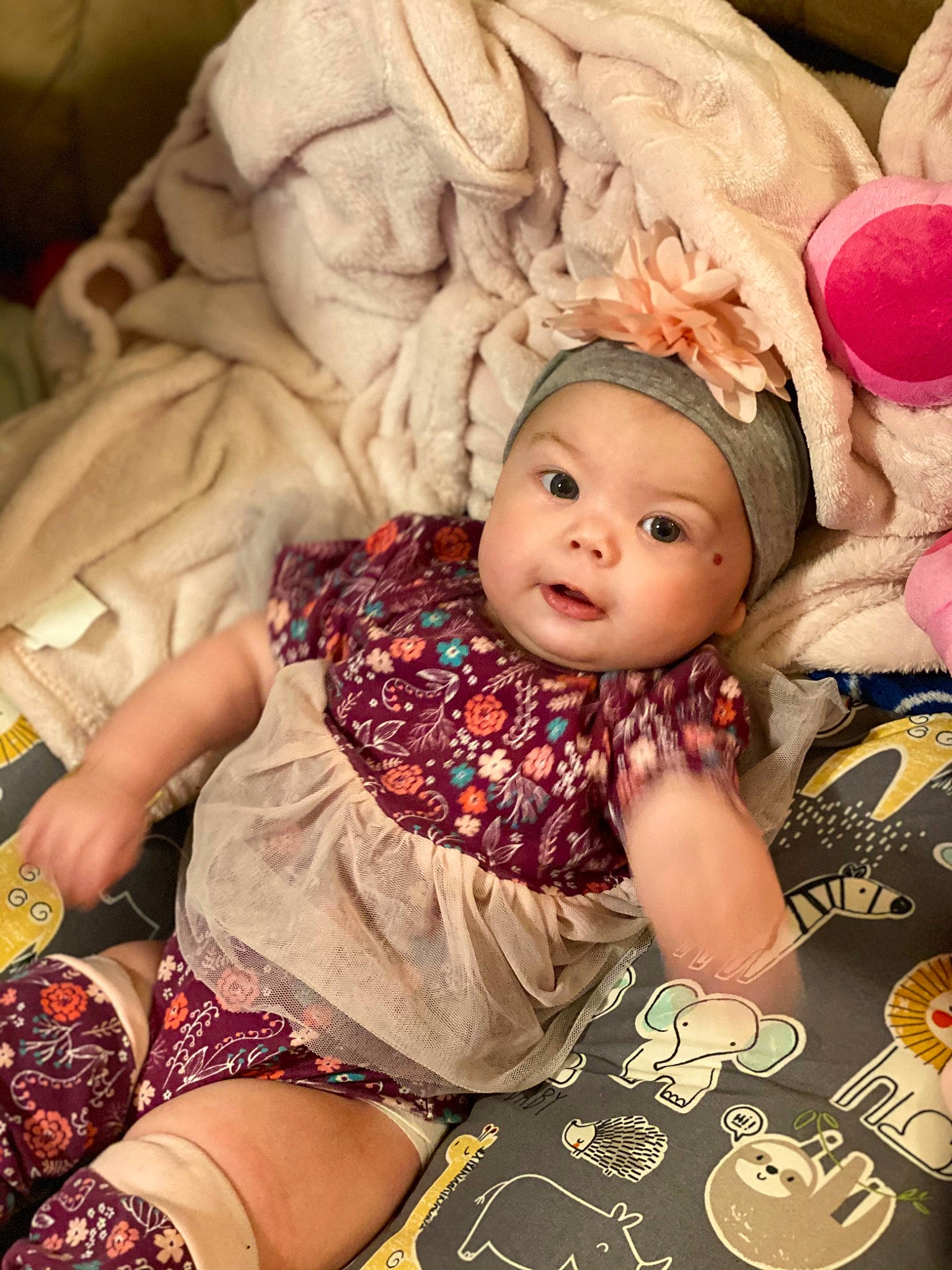 Kyleigh is registered to the contest to win money with this photo: baby, baby_toddler_clothing, cheek, child, comfort, doll, dress, eye, happy, head, headgear, headwear, human_body, mouth, person, pink, skin, stuffed_toy, textile, toddler