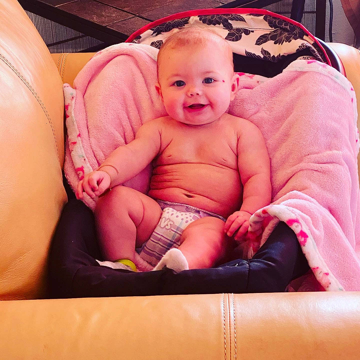 Kyleigh is registered to the contest to win money with this photo: baby, baby_toddler_clothing, cheek, chest, comfort, eye, finger, happy, head, knee, lap, leg, mouth, person, pink, skin, smile, stomach, textile, thigh