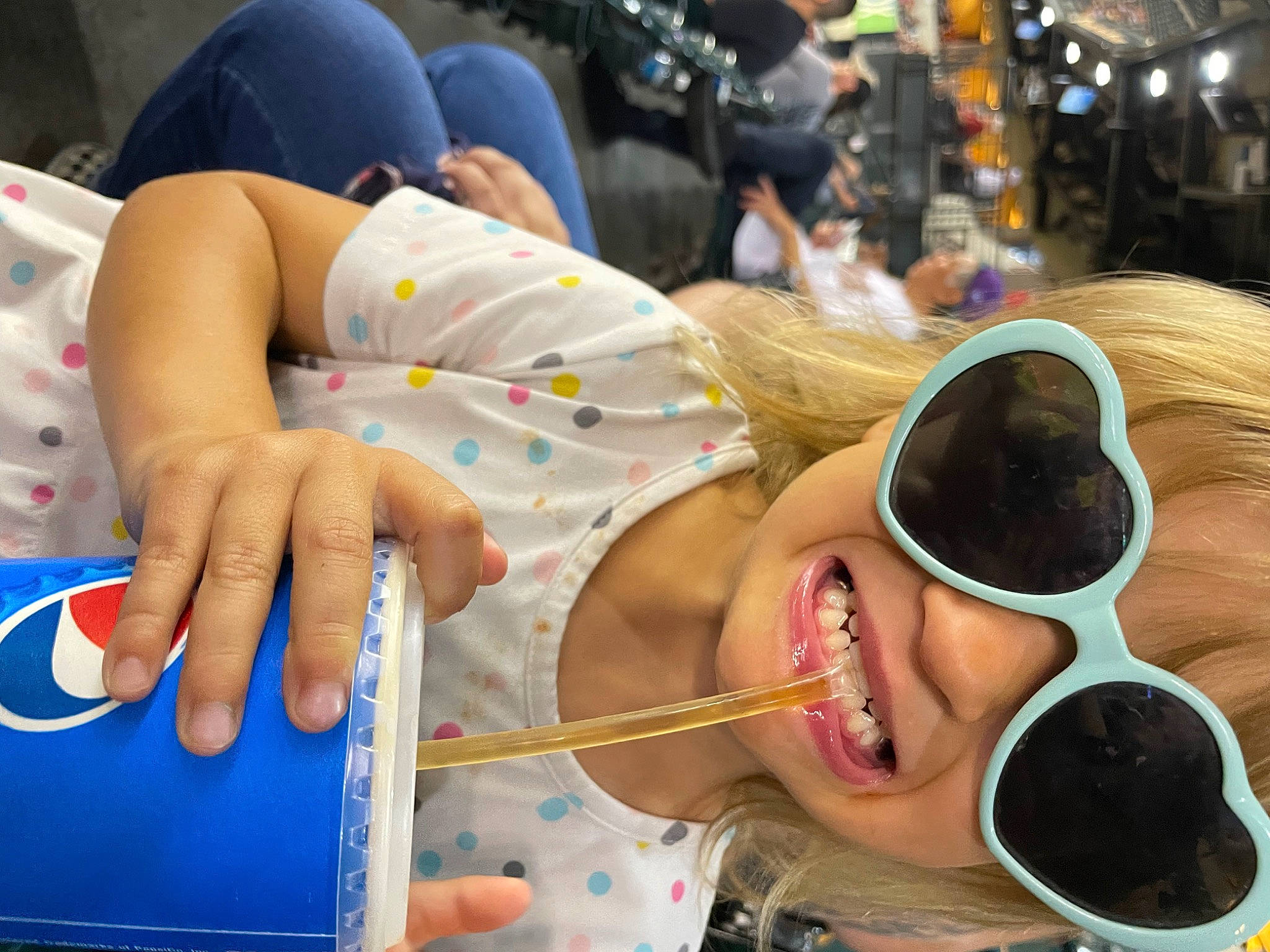 Piper is registered to the contest to win money with this photo: child, event, eyewear, fashion_accessory, finger, fun, goggles, happy, hat, joy, leisure, nail, person, personal_protective_equipment, recreation, sun_hat, sunglasses, t_shirt, vision_care