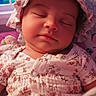 baby, bonnet, child, closeup, cozy, cute, face, floral_clothing, indoor, infant, moon, nighttime, peaceful, pink, portrait, resting, sleeping, soft_lighting, stars, window