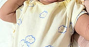 Amelia joined the competition — help win amazing prizes! baby, infant, smiling, yawning, onesie, clothing, bed, blanket, happy, cute, person, child, indoor, sleepwear, face, head, skin, joy, resting, cozy