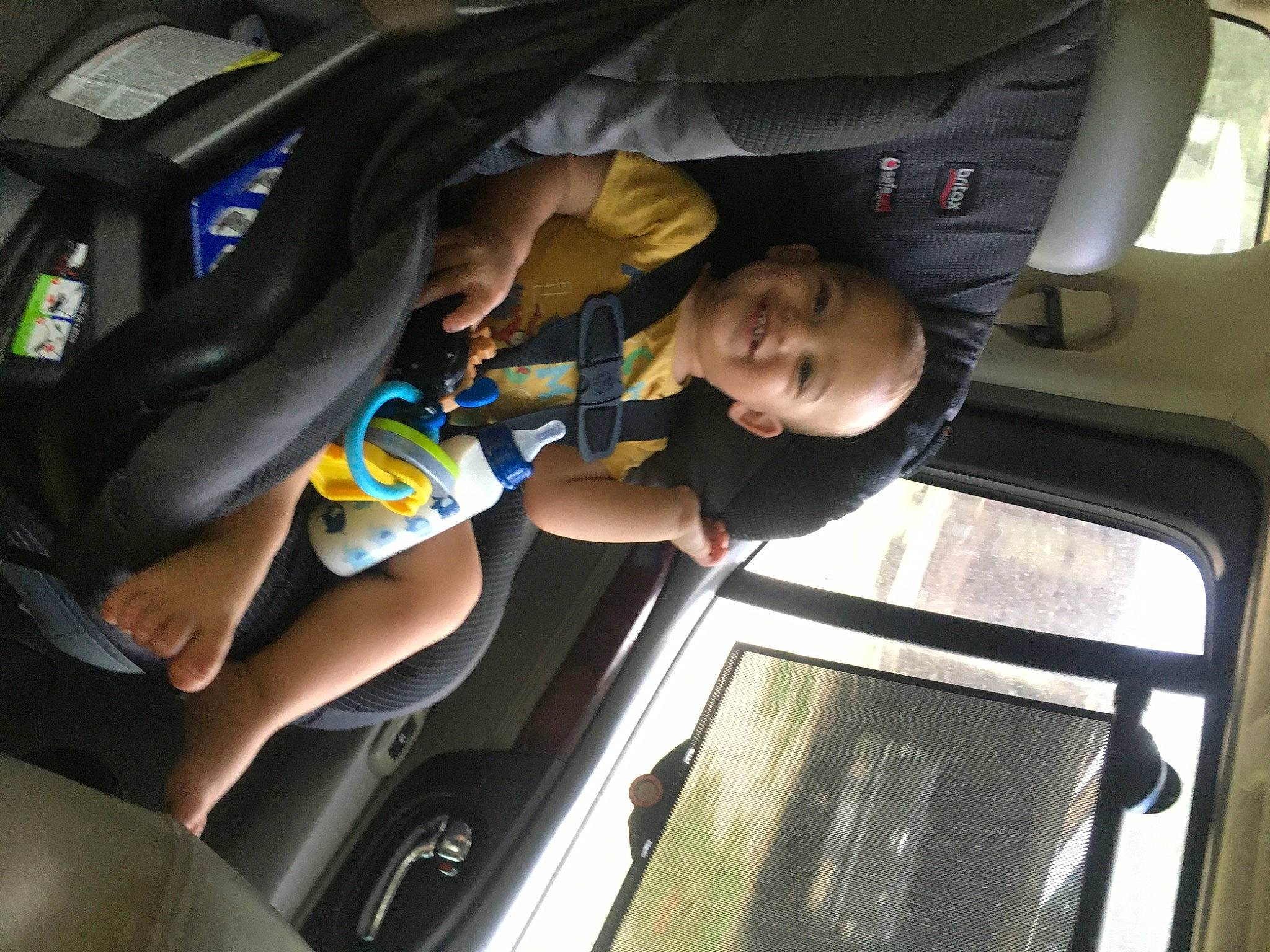 Mason Malachi is registered to the contest to win money with this photo: auto_part, automotive_design, automotive_exterior, car_seat, car_seat_cover, comfort, door, family_car, fun, hand, joy, leg, mode_of_transport, motor_vehicle, passenger, person, personal_luxury_car, smile, toddler, vehicle