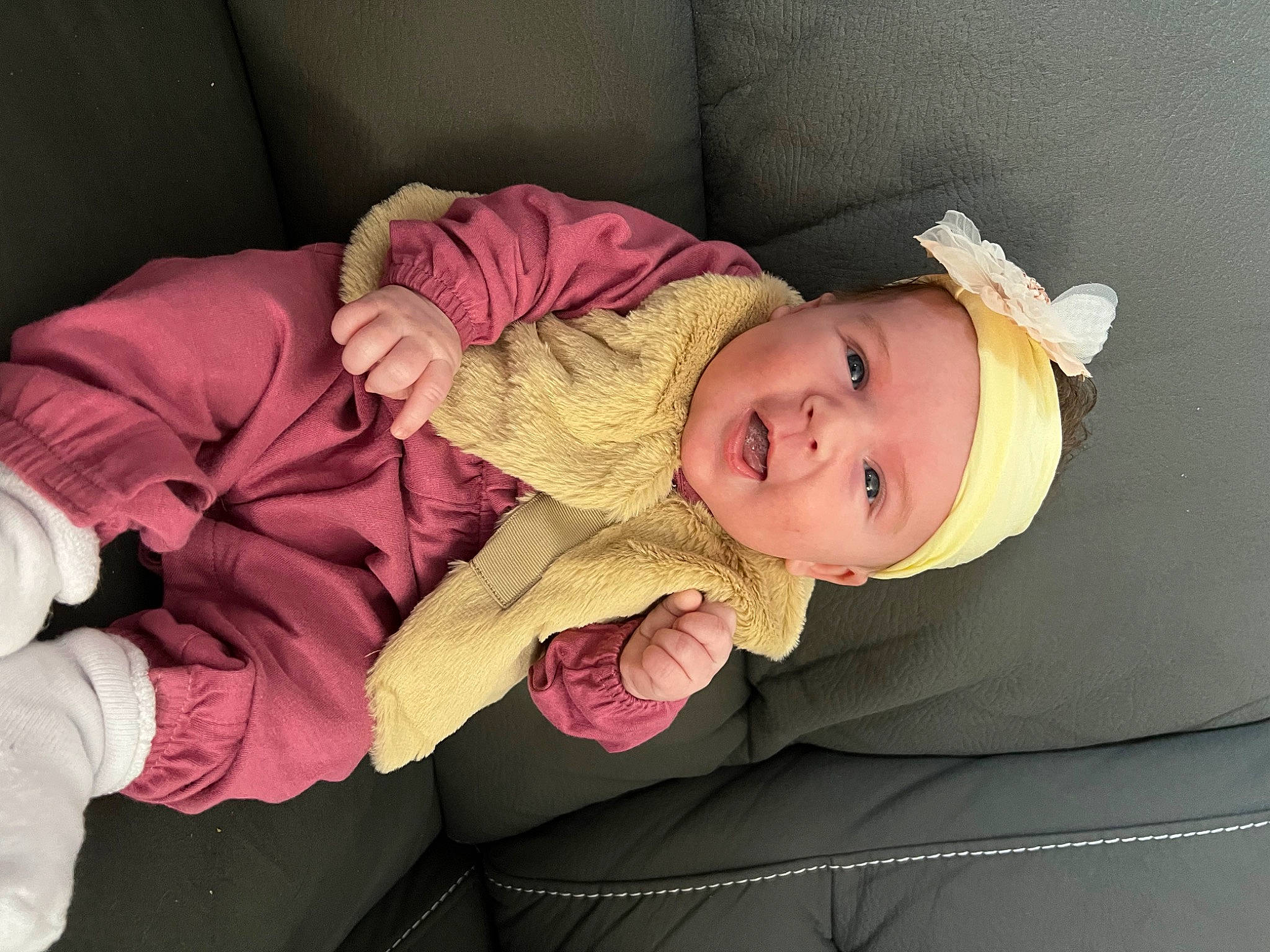 Sofie is registered to the contest to win money with this photo: baby, baby_toddler_clothing, beauty, cheek, child, comfort, couch, eye, face, finger, hat, headwear, lap, person, pink, room, skin, sleeve, smile, textile