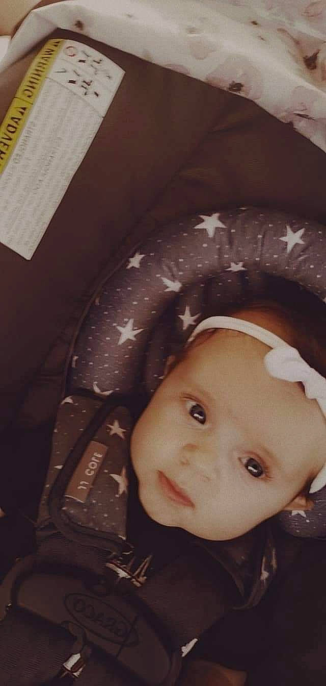 Maylynn is registered to the contest to win money with this photo: auto_part, automotive_tire, automotive_wheel_system, baby, cheek, child, chin, comfort, ear, eyebrow, eyelash, flash_photography, fun, headgear, iris, mouth, nose, person, skin, smile