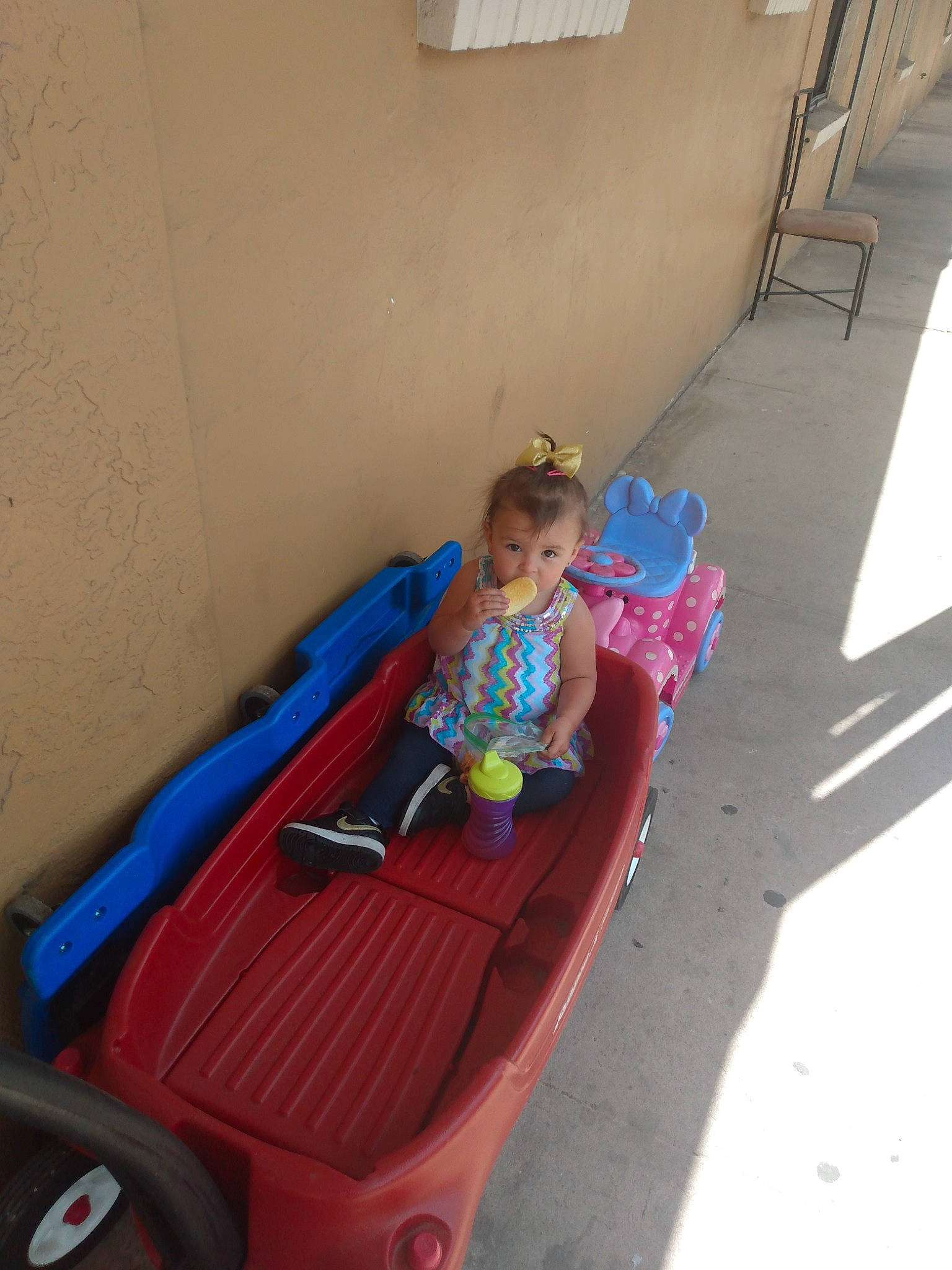 Kya is registered to the contest to win money with this photo: bumper, child, chute, city, electric_blue, flooring, fun, hair, leisure, outdoor_play_equipment, person, play, playground, playground_slide, recreation, riding_toy, shorts, sitting, toddler, vacation