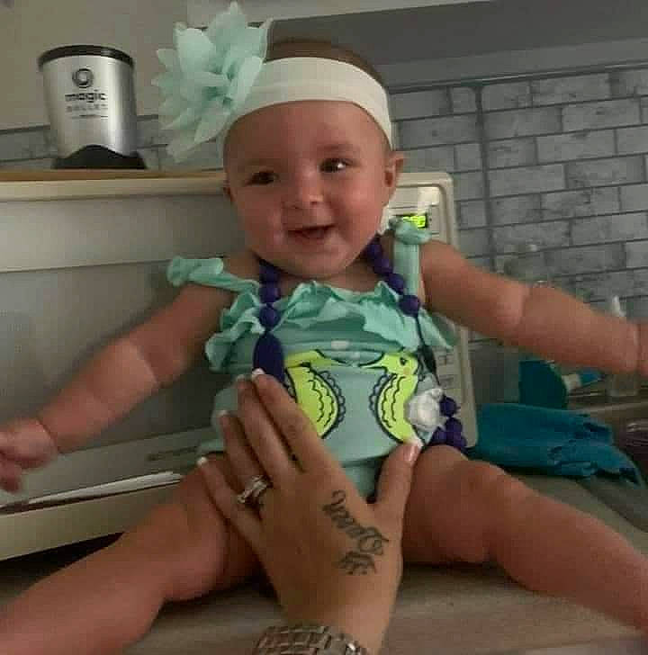 Kya joined the competition — help win amazing prizes! baby, baby_toddler_clothing, electric_blue, fashion_accessory, finger, foot, fun, gesture, happy, head, headwear, human_leg, joy, nail, person, service, sitting, skin, sleeve, smile