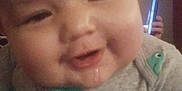 Elijah is registered to the contest to win money with this photo: baby, cheeks, child, closeup, clothing, cute, drool, face, gray_shirt, hand, happy, head, indoor, infant, person, phone, portrait, smile, whale_pattern, young_child