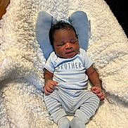Calvin joined the competition — help win amazing prizes! newborn, baby, infant, child, portrait, sleeping, lying_down, blanket, fluffy_blanket, blue_outfit, onesie, little_brother, socks, cushion, indoor, home, wood_floor, face, hands, family