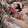 bed, blanket, cat, comfort, cozy, cute, domestic_animal, feline, floral_pattern, indoor, paw, pink_nose, quilt, relaxation, resting, sleeping, soft, striped, warm, white