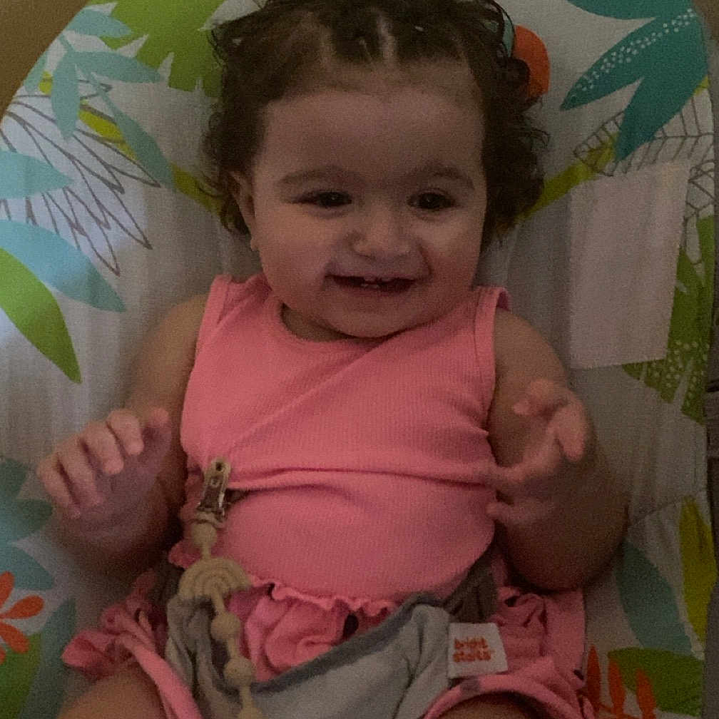 Mia participe au concours pour gagner de l'argent avec cette photo : baby, chair, clothing, cushion, cutlery, diaper, face, furniture, happy, head, homedecor, indoors, person, photography, portrait, shorts, sitting, smile, spoon, t_shirt