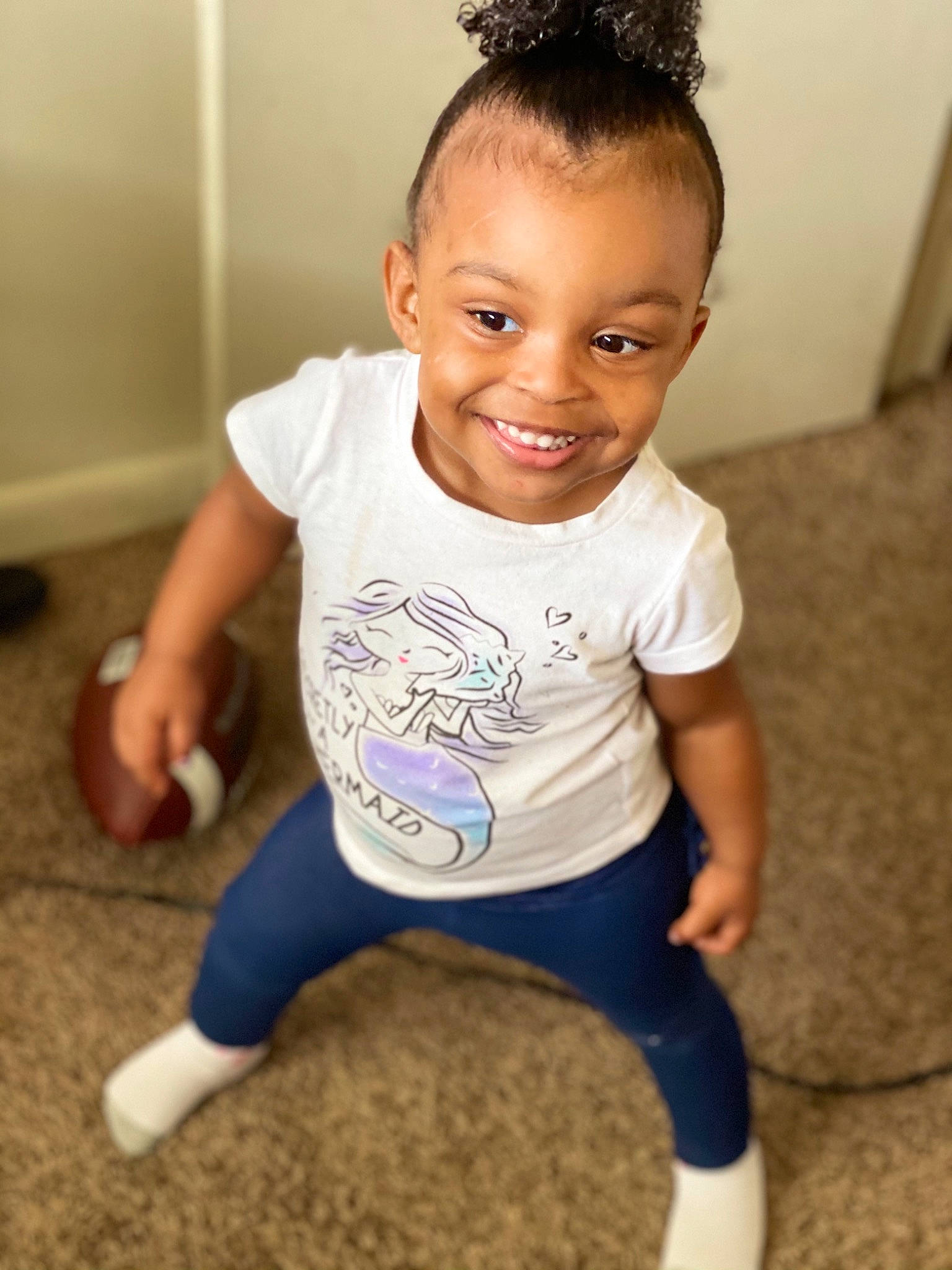 Maleah is registered to the contest to win money with this photo: active_pants, ankle, baby_toddler_clothing, balance, child, flooring, hair_accessory, joint, joy, knee, laugh, mouth, organ, person, physical_fitness, shoulder, sock, standing, style, sweatpant