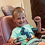 Enverson joined the competition — help win amazing prizes! child, boy, smiling, chair, tshirt, bmx, medical_device, finger_sensor, shorts, indoor, happy, person, casual_clothing, young, light_skin, short_hair, seated, healthcare, hospital, raising_fist