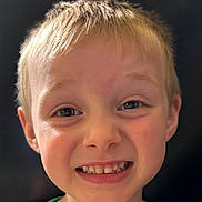Enverson is registered to the contest to win money with this photo: child, boy, smile, face, portrait, happy, blonde_hair, teeth, green_shirt, closeup, expression, person, cute, young, casual, childhood, human, head, innocence, joy