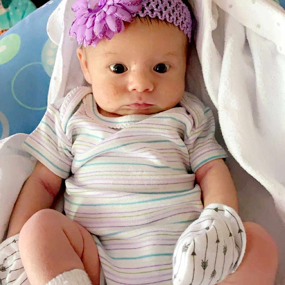 Chanell is registered to the contest to win money with this photo: arm, baby, baby_toddler_clothing, cap, cheek, comfort, doll, eyelash, finger, headgear, iris, lip, nail, pink, skin, sleeve, thigh, toy, white, wig