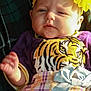 Rayne joined the competition — help win amazing prizes! baby, child, infant, headband, flower, face, clothing, tiger_print, plaid, skirt, purple, yellow, blue, blanket, pattern, person, portrait, sunlight, hand, cute
