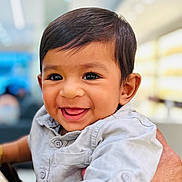 Adam joined the competition — help win amazing prizes! baby, child, smiling, indoor, person, shirt, hand, face, cute, portrait, young_child, happy, human, short_hair, skin, holding, buttoned_shirt, bright, background_blur, closeup