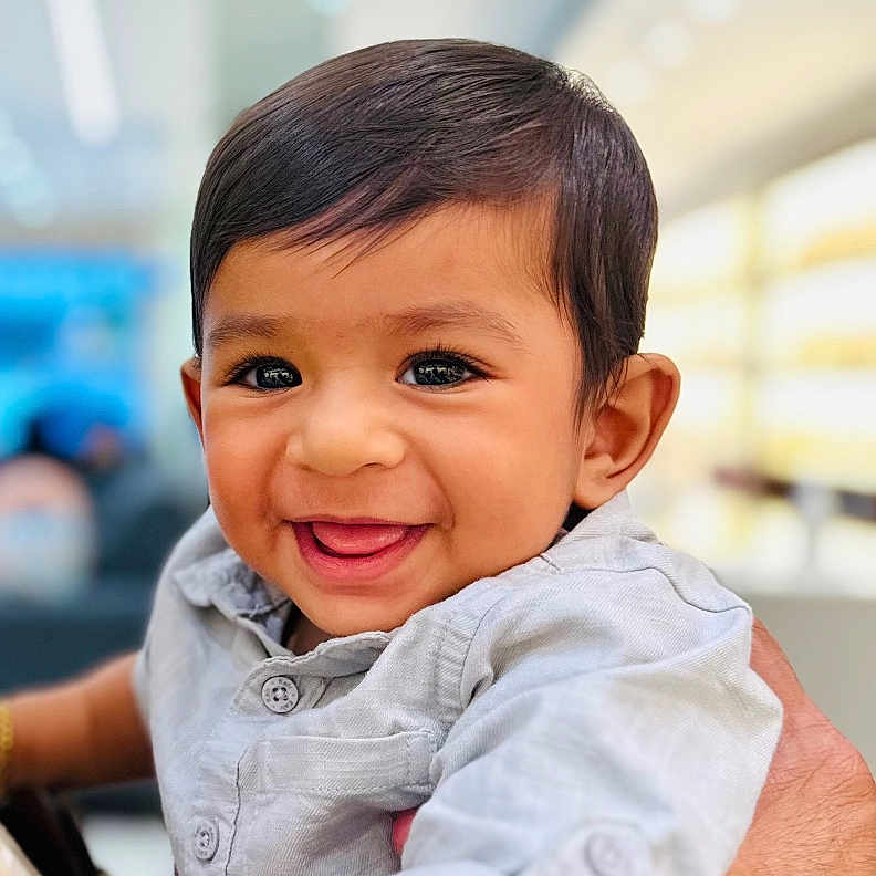 Adam joined the competition — help win amazing prizes! baby, background_blur, bright, buttoned_shirt, child, closeup, cute, face, hand, happy, holding, human, indoor, person, portrait, shirt, short_hair, skin, smiling, young_child